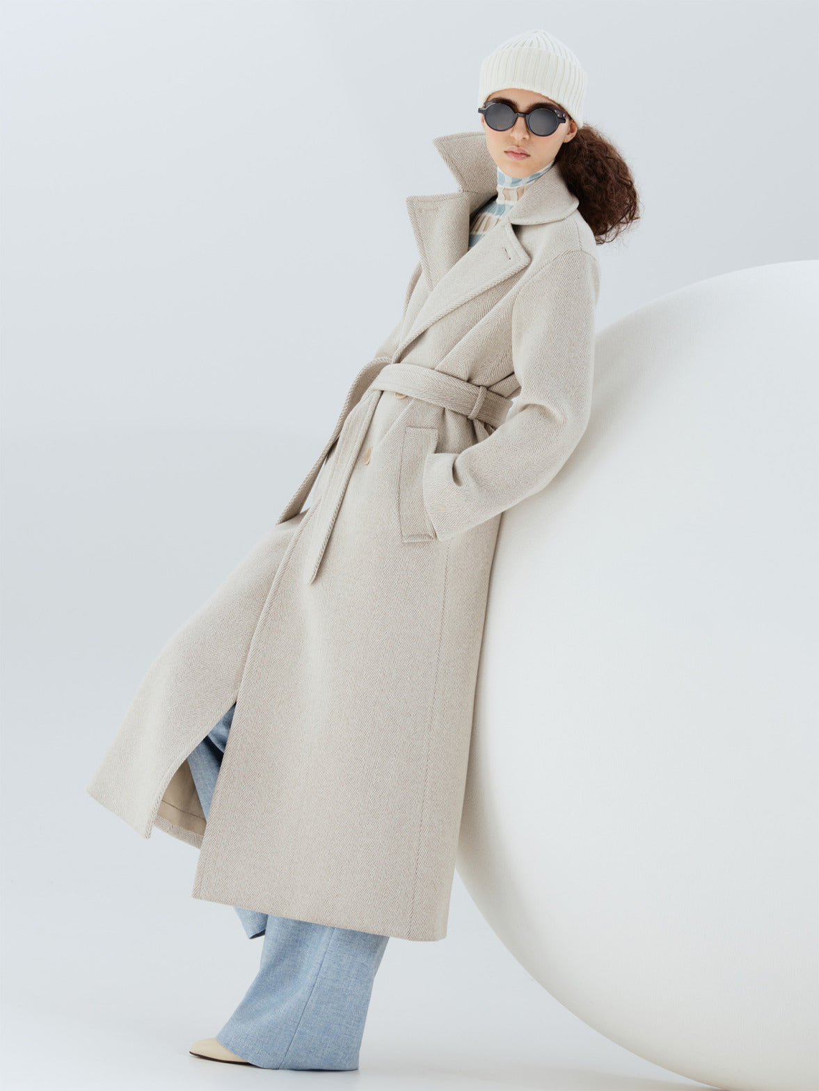 Look from the Akris punto Fall 2026 collection showcasing a luxurious wool coat and refined layering pieces with contemporary everyday elegance.