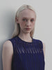 Embrace the romantic artistry of the Akris Spring collection, showcasing a breathtaking sleeveless dress adorned with intricate, delicate embroidery. Perfectly complementing the clean-lined aesthetic, this look beautifully captures light, fluid movement and modern feminine elegance. Experience timeless luxury and masterful Swiss craftsmanship.